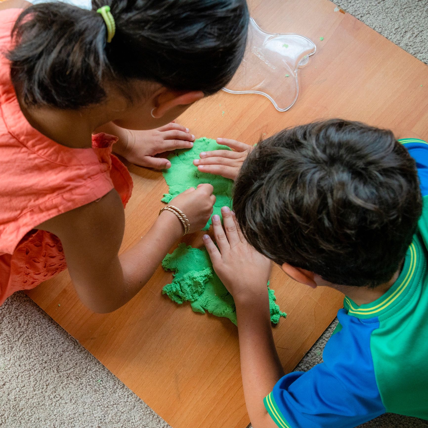 Children playing with sensory material during a fine motor activity