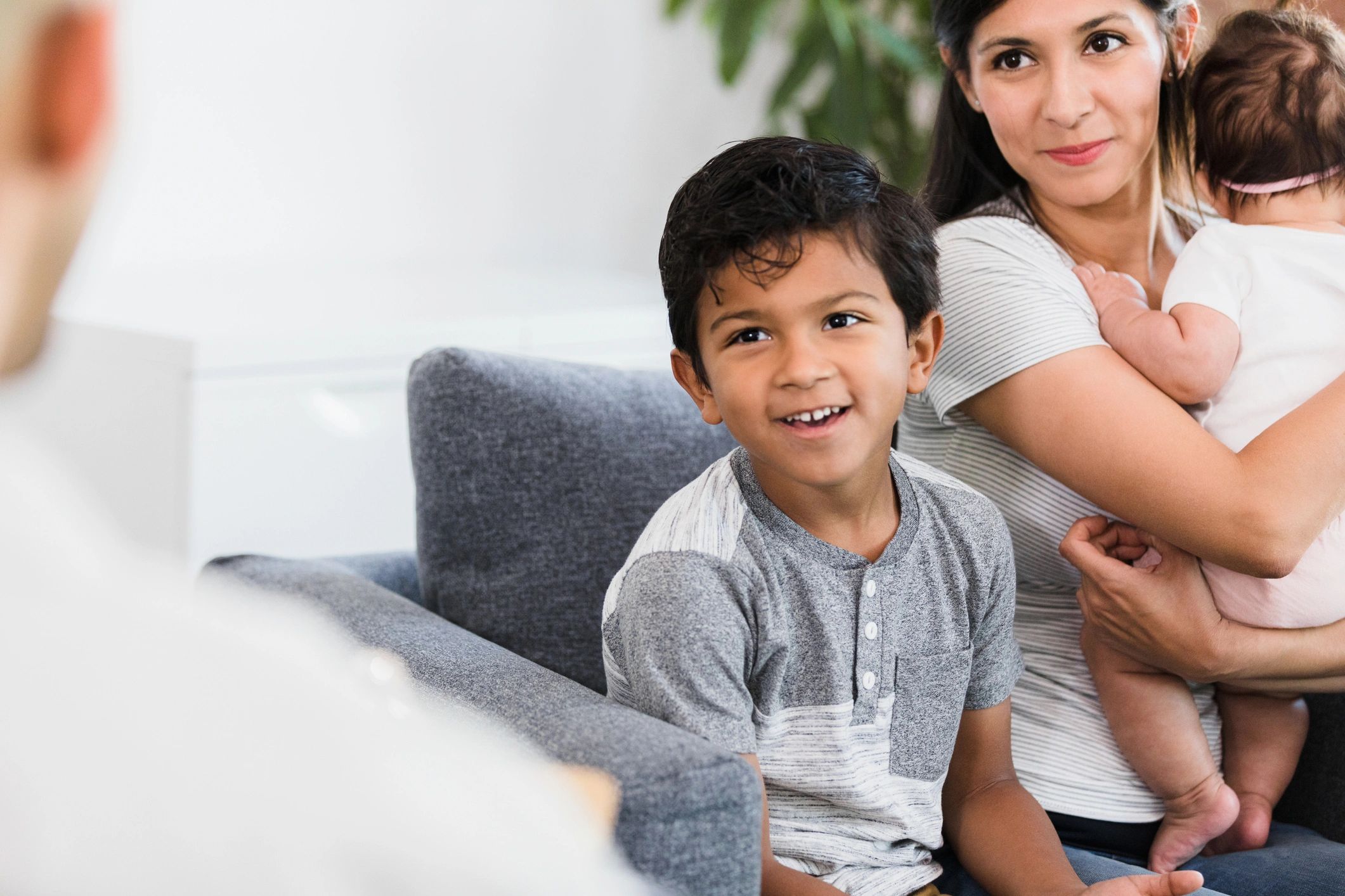 Therapist meeting with a parent and young children