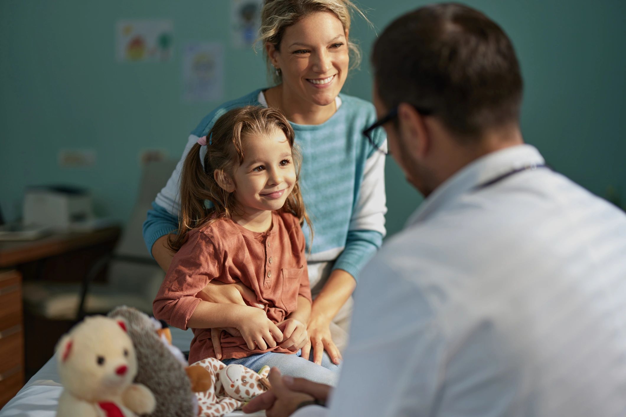 Parent supporting a child during a pediatric appointment
