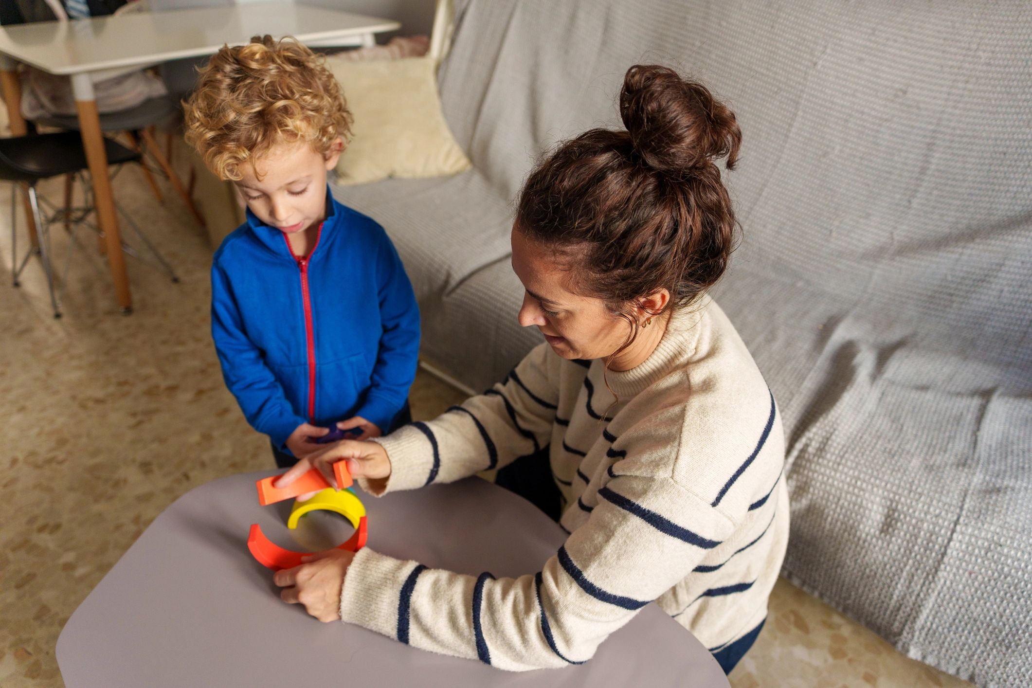 Parent and child building with blocks to support fine motor skills